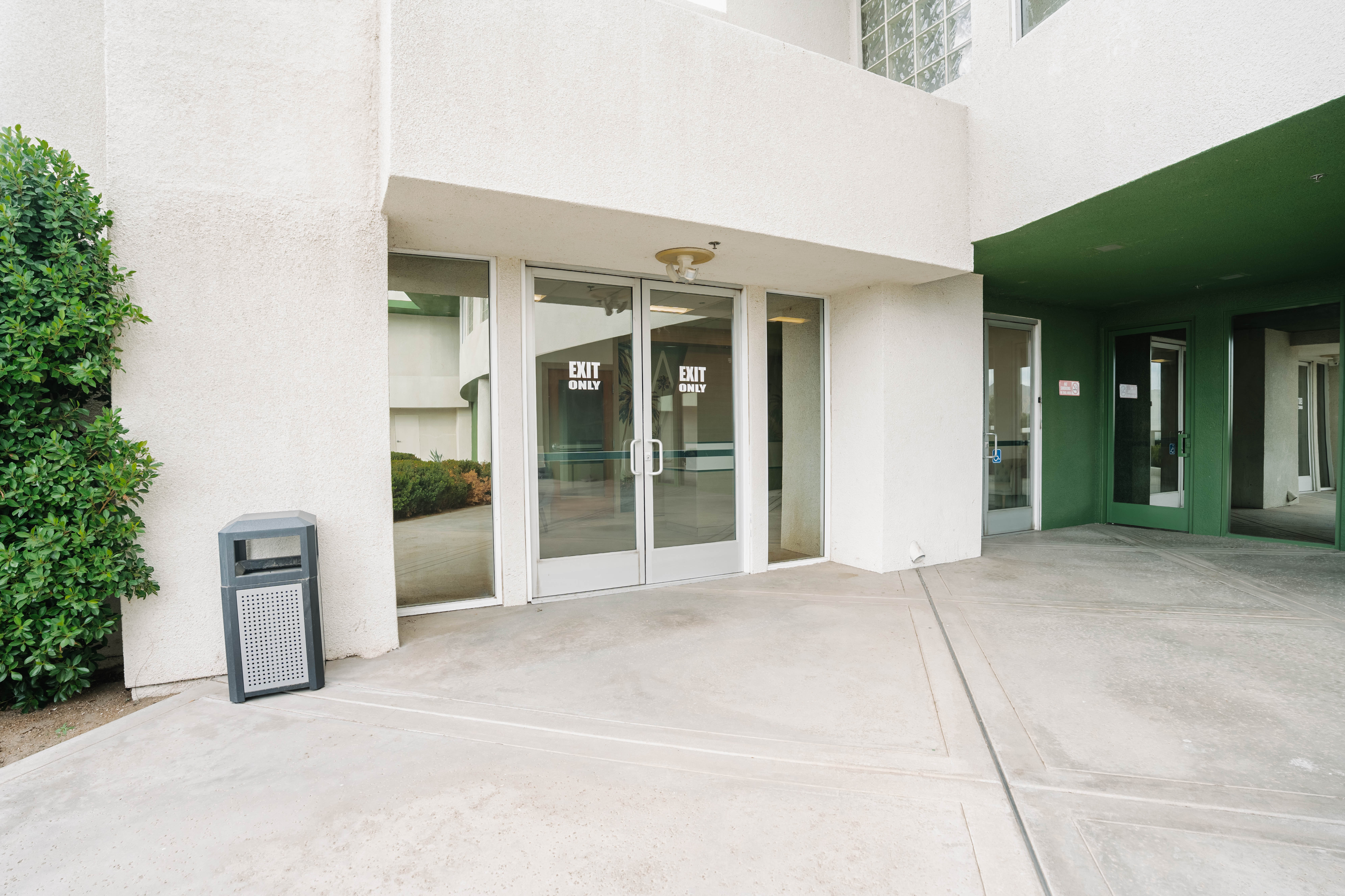 Glass entry doors and covered entrance